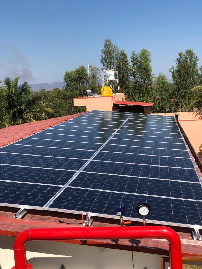 Powergate solar array on a terrace above red railings