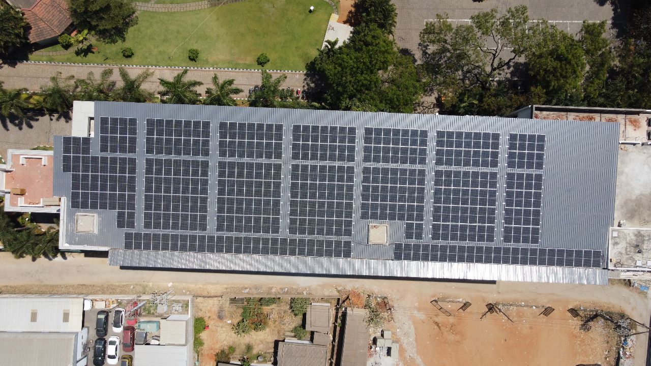 Aerial view of a long industrial roof covered with Powergate panels